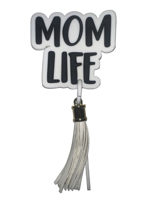 Decorative keychain with 'MOM LIFE' text and tassel on a gray background