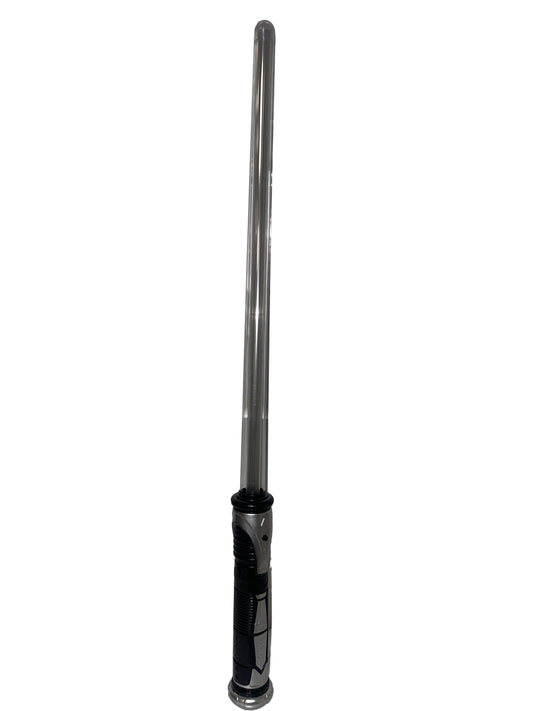 Long metal rod with a handle against a textured white wall